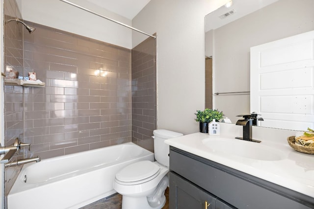 bathroom with visible vents, vanity, toilet, and tub / shower combination