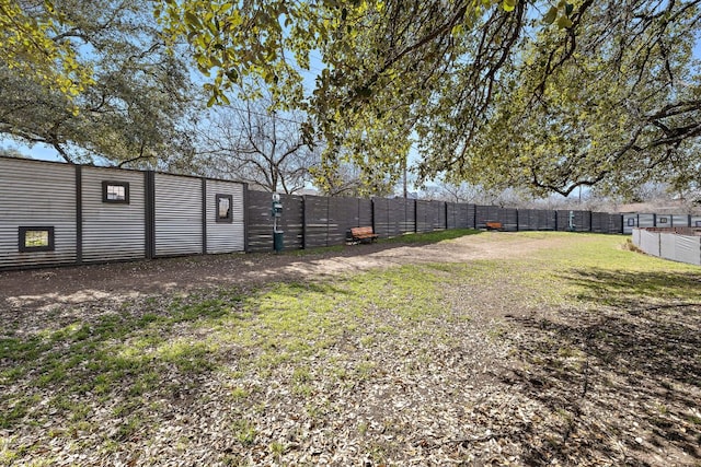 view of yard with a fenced backyard