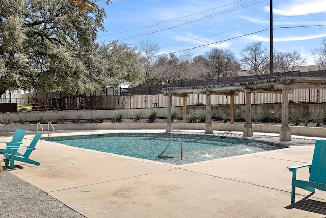 view of swimming pool featuring a patio area, a fenced in pool, fence, and a pergola