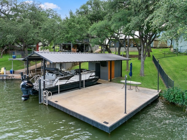 dock area featuring boat lift, a yard, a water view, and fence