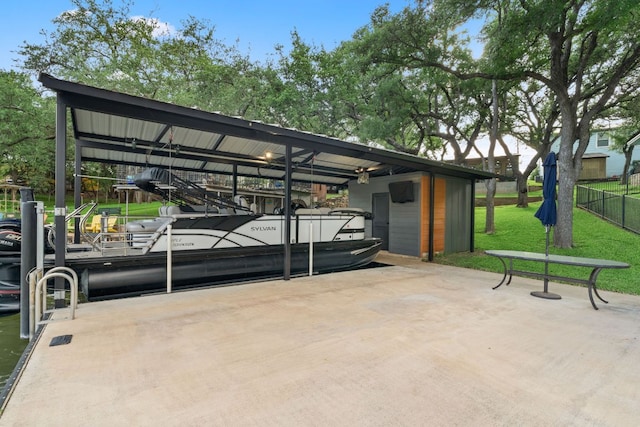 view of parking / parking lot featuring fence