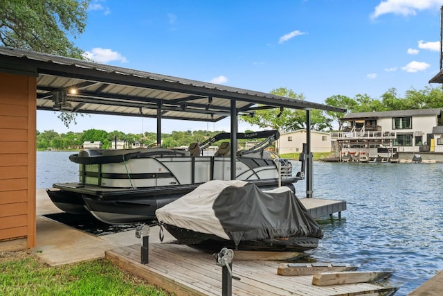 view of dock with a water view and boat lift