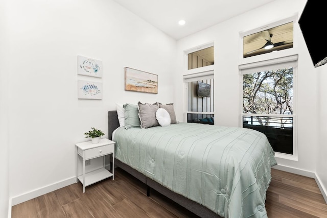 bedroom with recessed lighting, baseboards, and wood finished floors