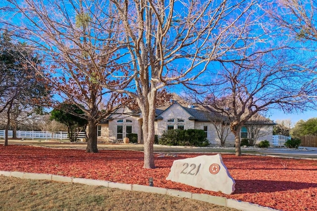 view of front of house with fence