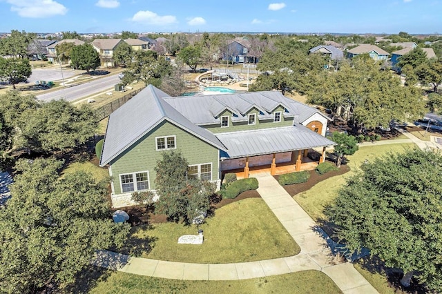 birds eye view of property with a residential view