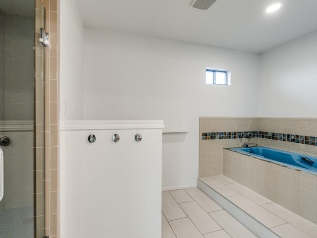 bathroom featuring a stall shower, visible vents, a garden tub, and tile patterned floors