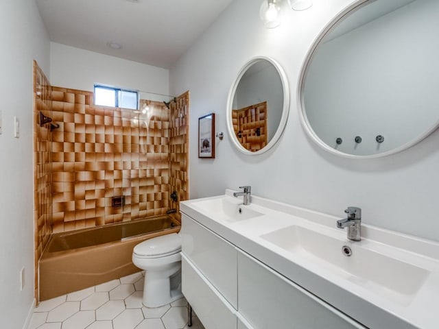 bathroom with toilet, shower / washtub combination, a sink, and tile patterned floors