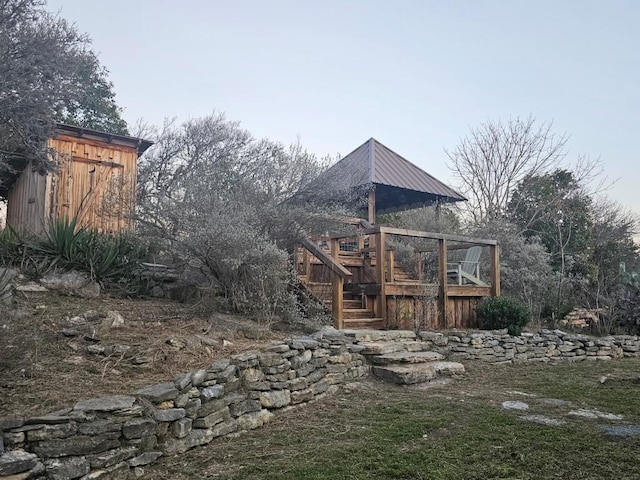 exterior space featuring stairway and a wooden deck