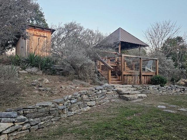 view of yard featuring stairway and a wooden deck