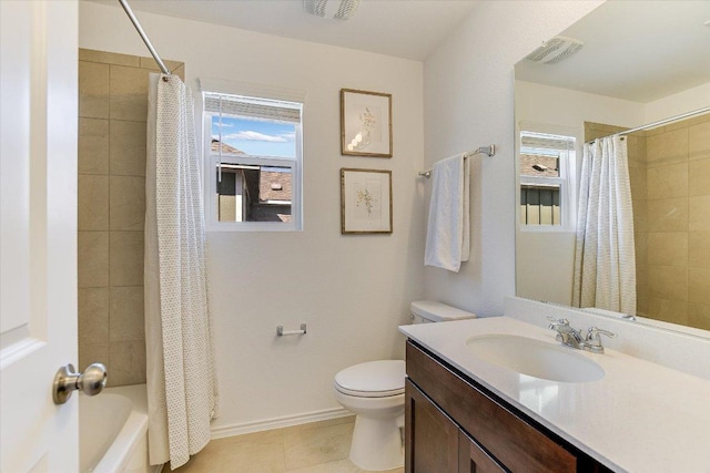 bathroom featuring toilet, baseboards, visible vents, and a healthy amount of sunlight