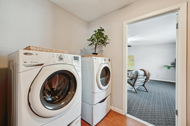 2403 Remuda Trl, Austin, TX 78745 - laundry room featuring washing machine and dryer, baseboards, and light wood finished floors