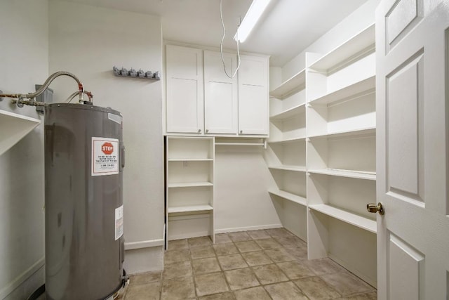 utility room featuring electric water heater