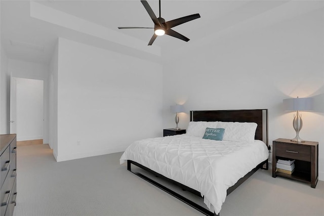 carpeted bedroom featuring a ceiling fan and baseboards