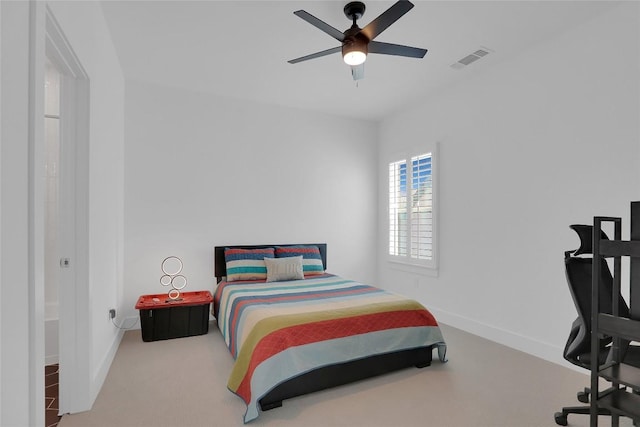 bedroom featuring carpet floors, a ceiling fan, visible vents, and baseboards