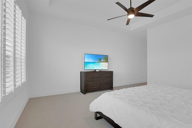 bedroom with carpet, ceiling fan, and baseboards