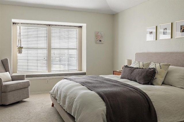 carpeted bedroom featuring vaulted ceiling