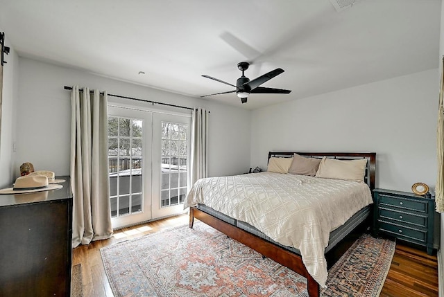 bedroom featuring access to outside, ceiling fan, and wood finished floors