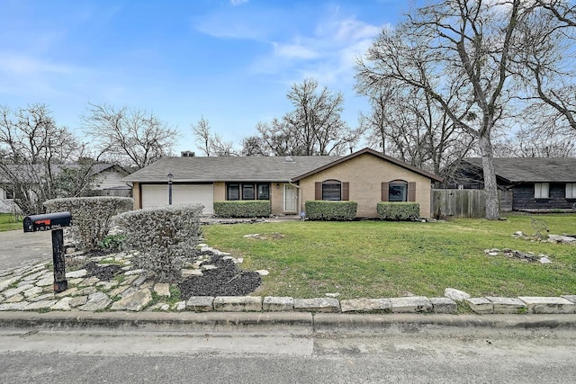 view of front of home with brick siding, fence, a garage, driveway, and a front lawn