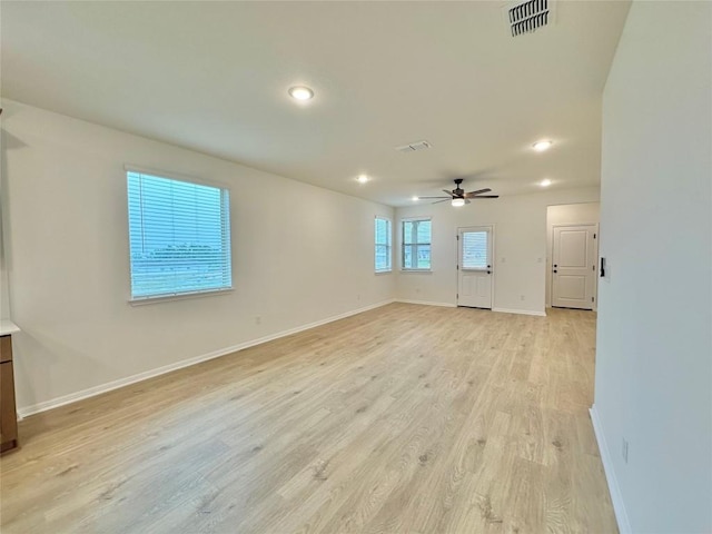 255 Glocken Ln, Kyle, TX 78640 - empty room featuring ceiling fan, light wood-type flooring, baseboards, and recessed lighting