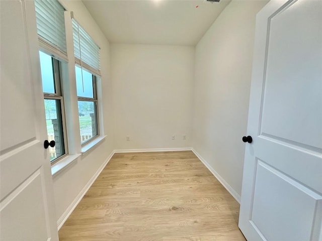 255 Glocken Ln, Kyle, TX 78640 - spare room featuring light wood-style floors and baseboards