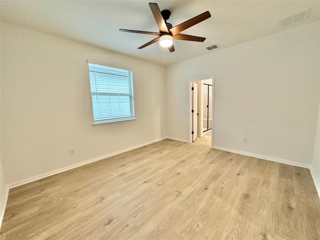 255 Glocken Ln, Kyle, TX 78640 - empty room featuring ceiling fan, light wood finished floors, and baseboards