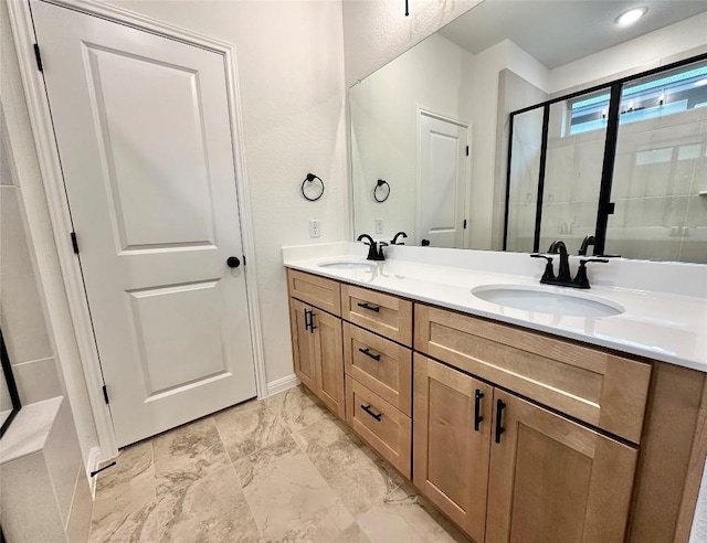 255 Glocken Ln, Kyle, TX 78640 - bathroom featuring double vanity, a stall shower, and marble look tiles