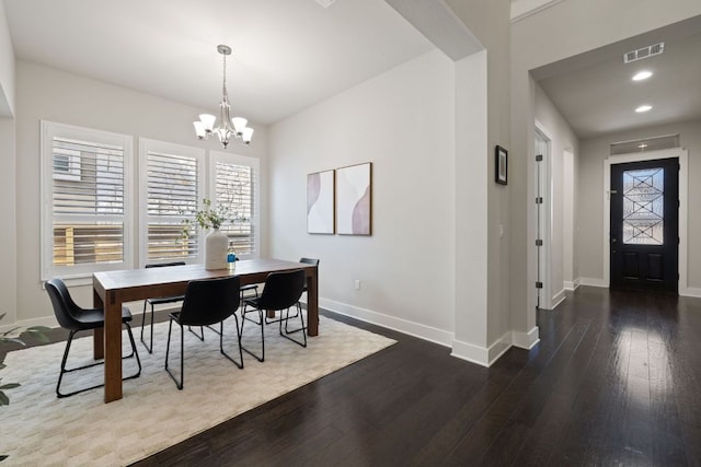 dining room featuring baseboards, visible vents, dark wood-style flooring, a chandelier, and recessed lighting