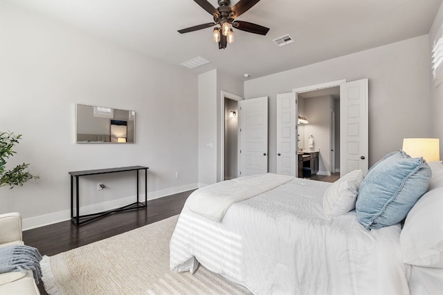 bedroom with baseboards, visible vents, ceiling fan, and wood finished floors