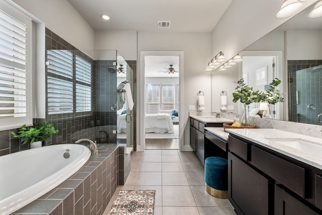 bathroom featuring a sink, visible vents, a bath, tile patterned floors, and ensuite bath