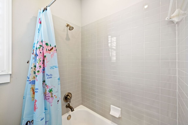 bathroom with shower / bath combo