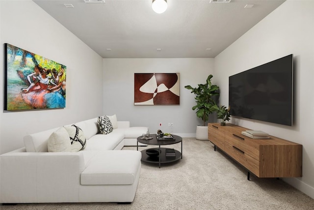 living area featuring carpet flooring, visible vents, and baseboards