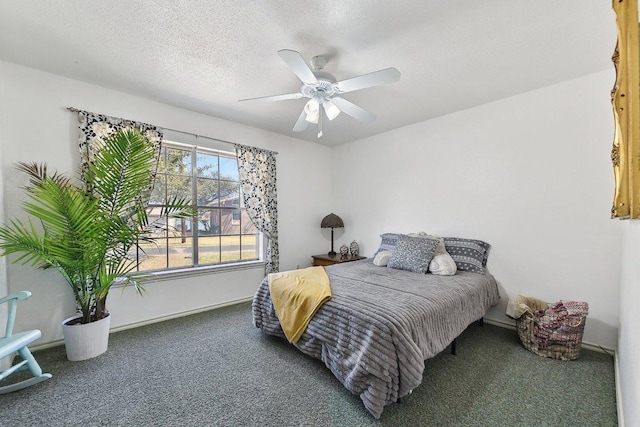 carpeted bedroom with a textured ceiling, a ceiling fan, and baseboards