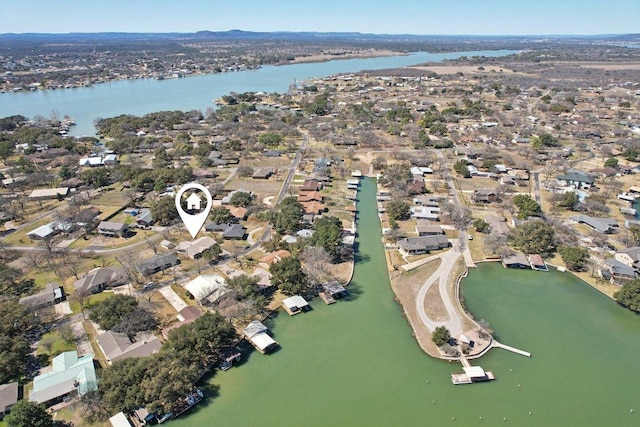 drone / aerial view with a residential view and a water view