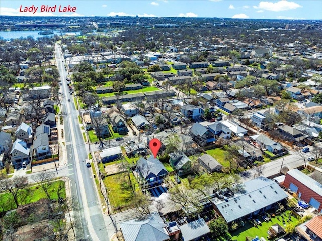 birds eye view of property with a residential view