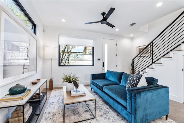 living room with plenty of natural light, visible vents, baseboards, and recessed lighting