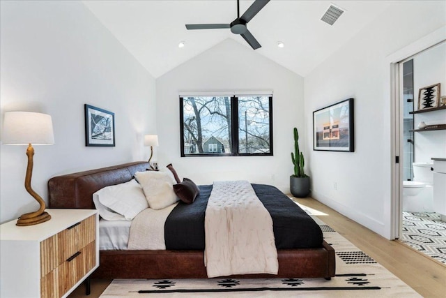 bedroom with high vaulted ceiling, connected bathroom, recessed lighting, wood finished floors, and visible vents