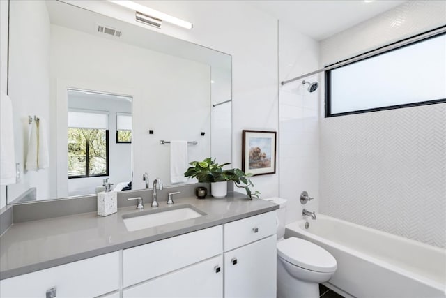 full bathroom featuring visible vents, shower / bathtub combination, vanity, and toilet