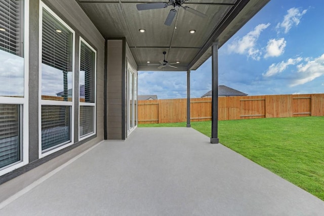 view of patio featuring a fenced backyard and a ceiling fan