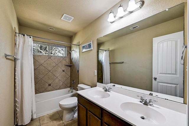 bathroom with toilet, visible vents, and a sink