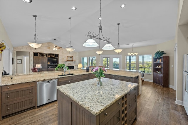 kitchen with dishwasher, a kitchen island, a sink, and dark wood-style floors