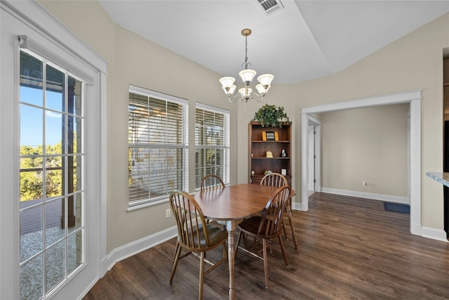 dining room featuring dark wood-style flooring, visible vents, and baseboards