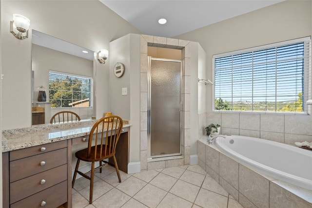 full bath with tile patterned flooring, a shower stall, a garden tub, and a wealth of natural light