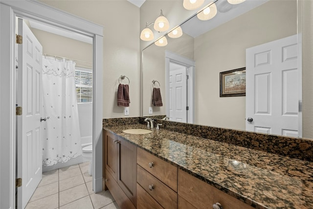 full bath featuring toilet, curtained shower, tile patterned flooring, and vanity