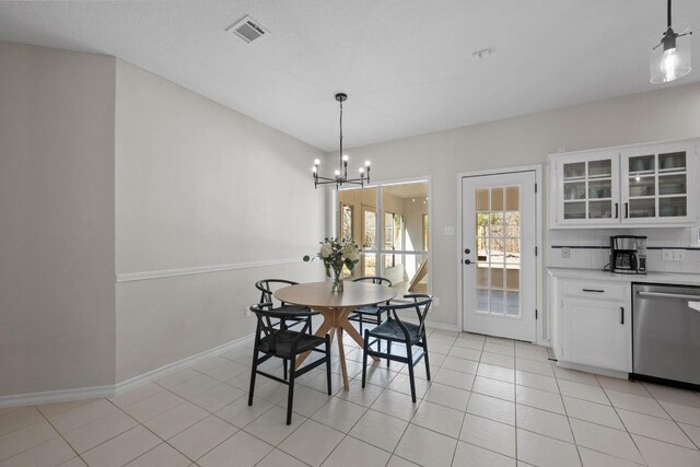 6202 Sotol Cv, Austin, TX 78759 - dining space with a chandelier, baseboards, and light tile patterned flooring