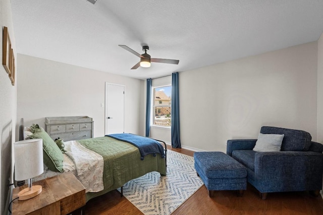 bedroom featuring a ceiling fan and wood finished floors