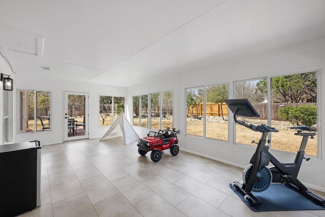 unfurnished sunroom featuring a wealth of natural light