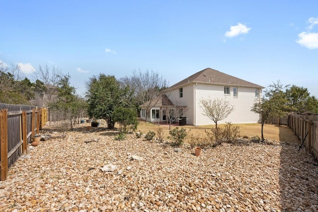 exterior space with a fenced backyard