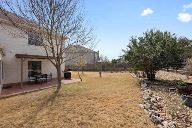 view of yard with a patio and a fenced backyard