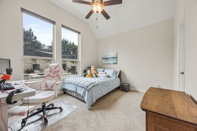 bedroom with light carpet, ceiling fan, lofted ceiling, and baseboards