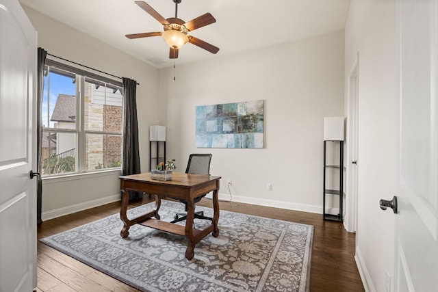 office featuring ceiling fan, wood finished floors, and baseboards